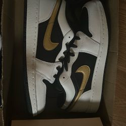Low Top Air Jordan 1’s  Black And White With Gold Nike Logo 