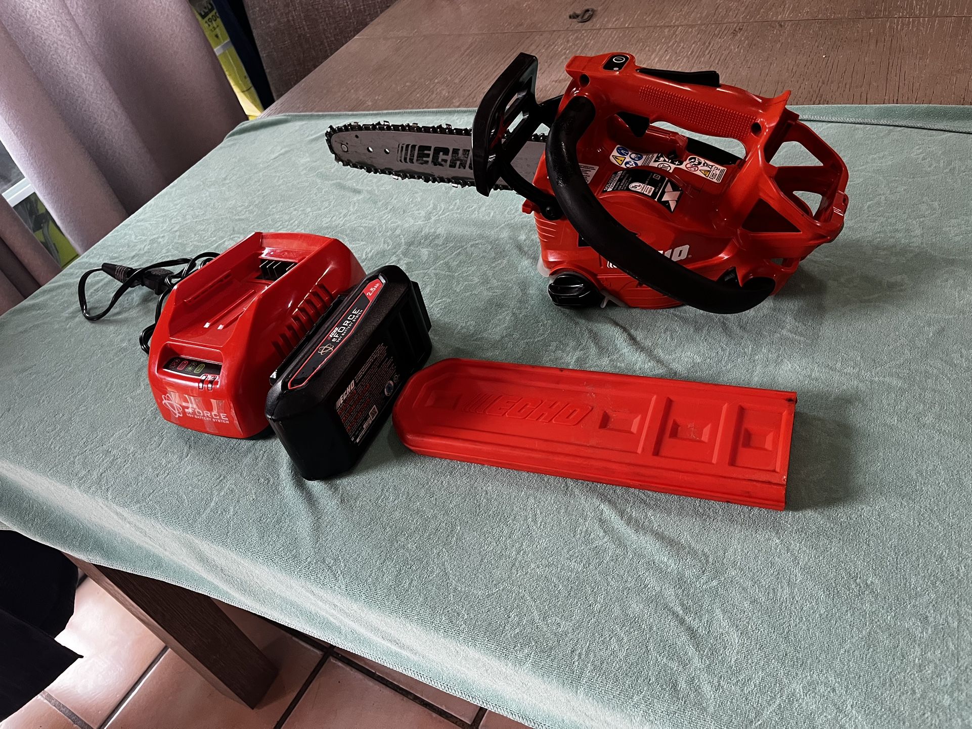 Echo 56 V 12 inch chainsaw cordless with battery 2.5 charger please redescription