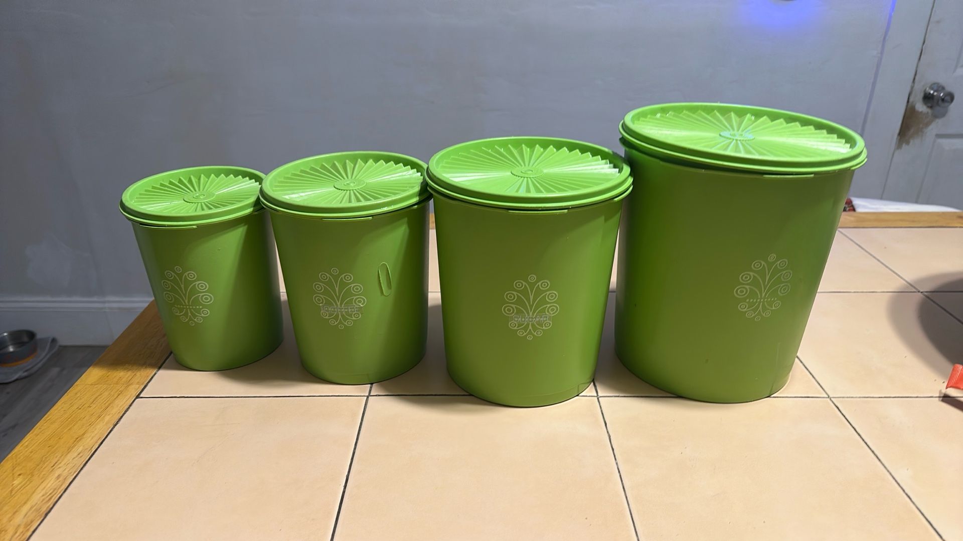 Old fashioned green Tupperware, canastiers, Flour, Sugar, Coffee, Tea.