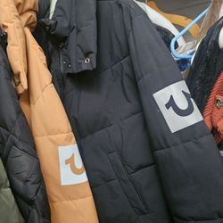 True Religion branded puffer jacket, recognized by the signature horseshoe logo on the sleeve-$80