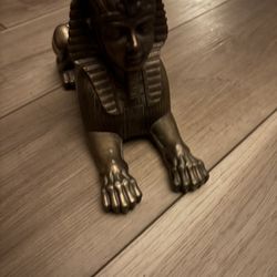 Egyptian Sphinx bronzed. The Sphinx is a mythical creature with the body of a lion and the head of a human, a symbol of ancient Egypt. 