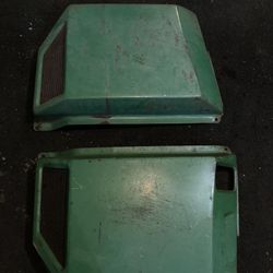 Side covers for a 318 John Deere tractor