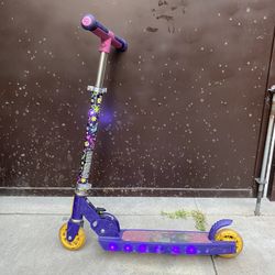 Encanto 2-Wheel Light-Up Kick Jetson Scooter, Sparkling LED lights in the frame and wheels. Foldable, height-adjustable, and smooth rolling.