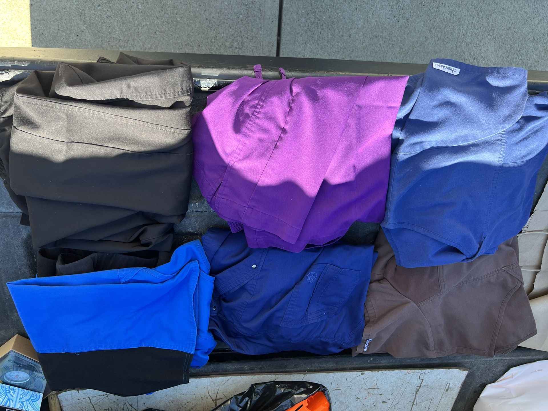 5 Sets of Scrubs  , And a pair of Black Scrub Pants .Size Large Very Good Condition. 
