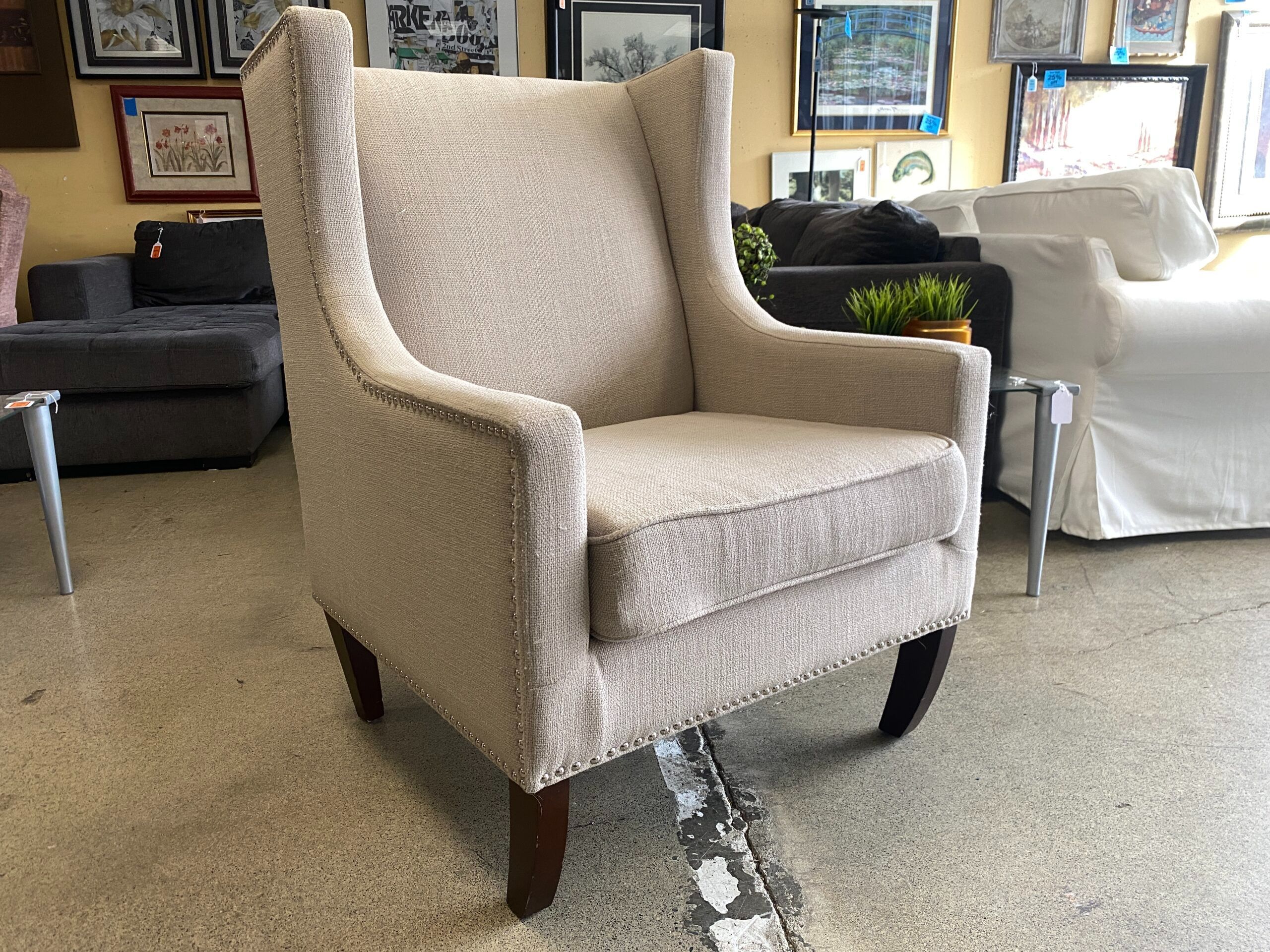 Beige Upholstered Wingback Armchair w/ Nailhead Trim