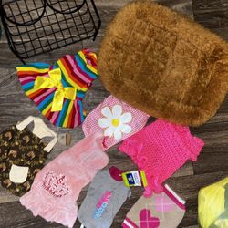 New & Preowned size XS female doggie clothes and a small pet bed and food tray holder. Located off lake mead and Simmons area asking $15 for all