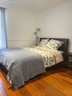Dark Brown Leather Upholstered Queen Platform Bed (with mattress) and a matching nightstand