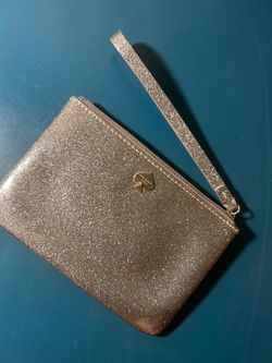 kate spade Silver Glitter Wristlet Clutch with Strap with Gold logo