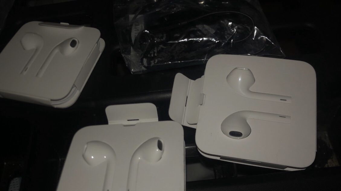3 pairs of New Apple lightning earphones w/ microphone + Free pair of headphones with regular auxiliary cord.