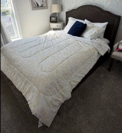 Queen sized bed with mattress and headboard