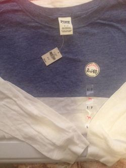Nwts Victoria's Secret "Pink" boyfriend baseball Tshirt in Chambray blue and white. Size is a Small. Could fit up to a Large and even XLarge