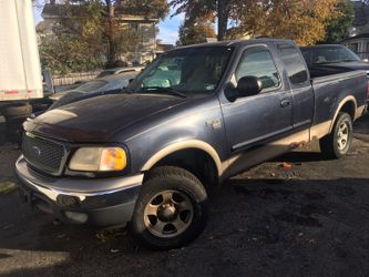 2001 FORD F150 AUTO 4x4 EXT CAB FOUR DOORS SOME RUST ON DOORS has 90,000 MILES ONLY