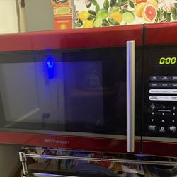900 watt red and black microwave