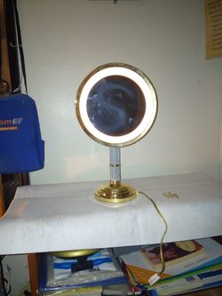 Vintage,halo lighted mirror magnifying vanity.