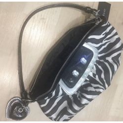 Bebe zebra print clutch with a strap