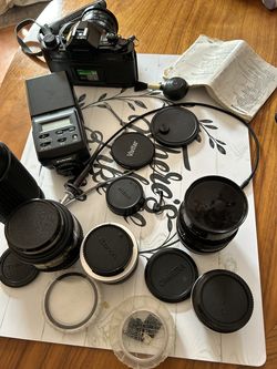 Canon camera/ Lens/ lens caps / Flash/Canon film/Camera brush/2 camera clickers