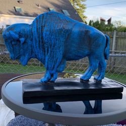 The old blue buffalo statue