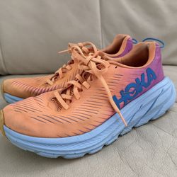 Hoka Vibrant Orange and Purple Athletic Shoes, size 8. Please see photo - hole