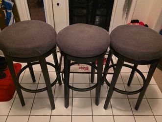 set of three backless, counter-height swivel barstools