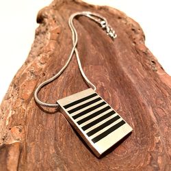 Metal & Black Enamel Pendant On Snake Chain