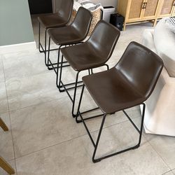 Four Brown Bar Stools