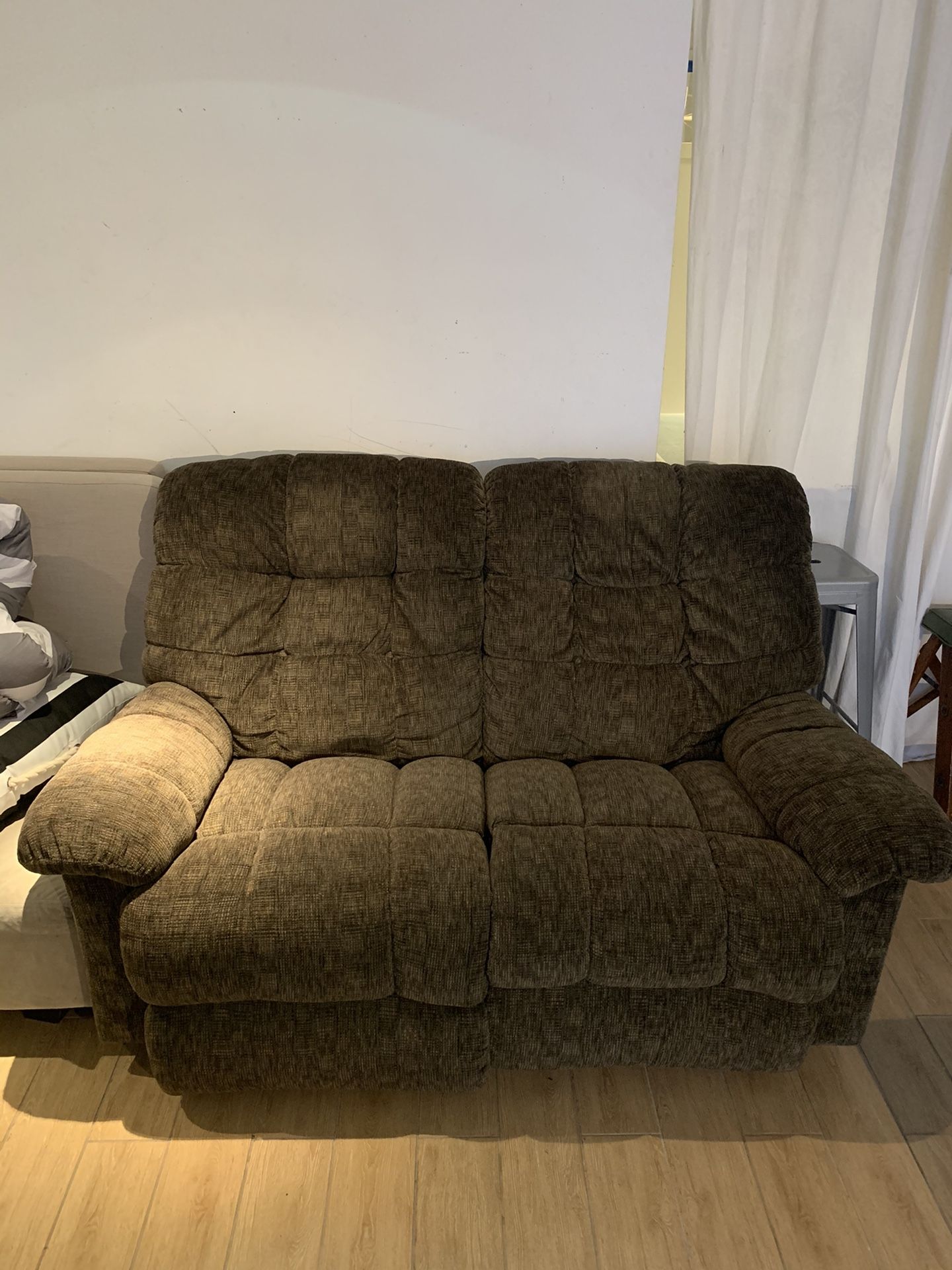 Soft green loveseat recliner