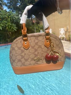 Coach bags with bag charm for sale