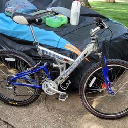 Pacific 7500 superlight wieght Full Suspension mountain bike. 18.5" Aluminum Frame. Shimano 24 speed shifter. 26x2.10 maxxis tires. 