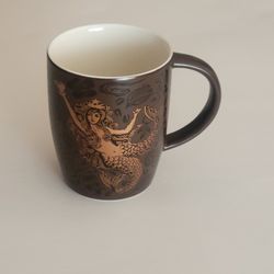 Starbucks Split Tail Mermaid 40th Anniversary 2011 Coffee Mug Brown 
Copper Siren. Pre-owned, very good shape, no chips or cracks. It is 4" 
tall, wei