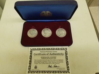 Display of Morgan Silver Dollars, 1880 S, 81 S, and 82 S with Authenticity