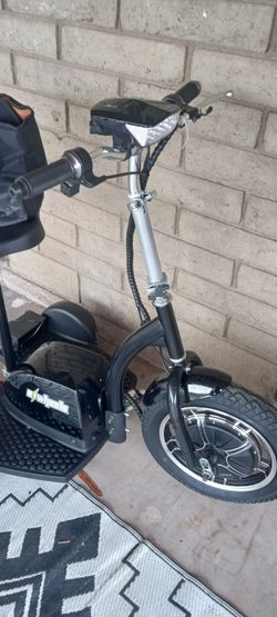 E tricycle electric bike awesome new right out of the box 500 watt motor 16 inch front wheel 10-in wheels in the back never been rode comes with a bas