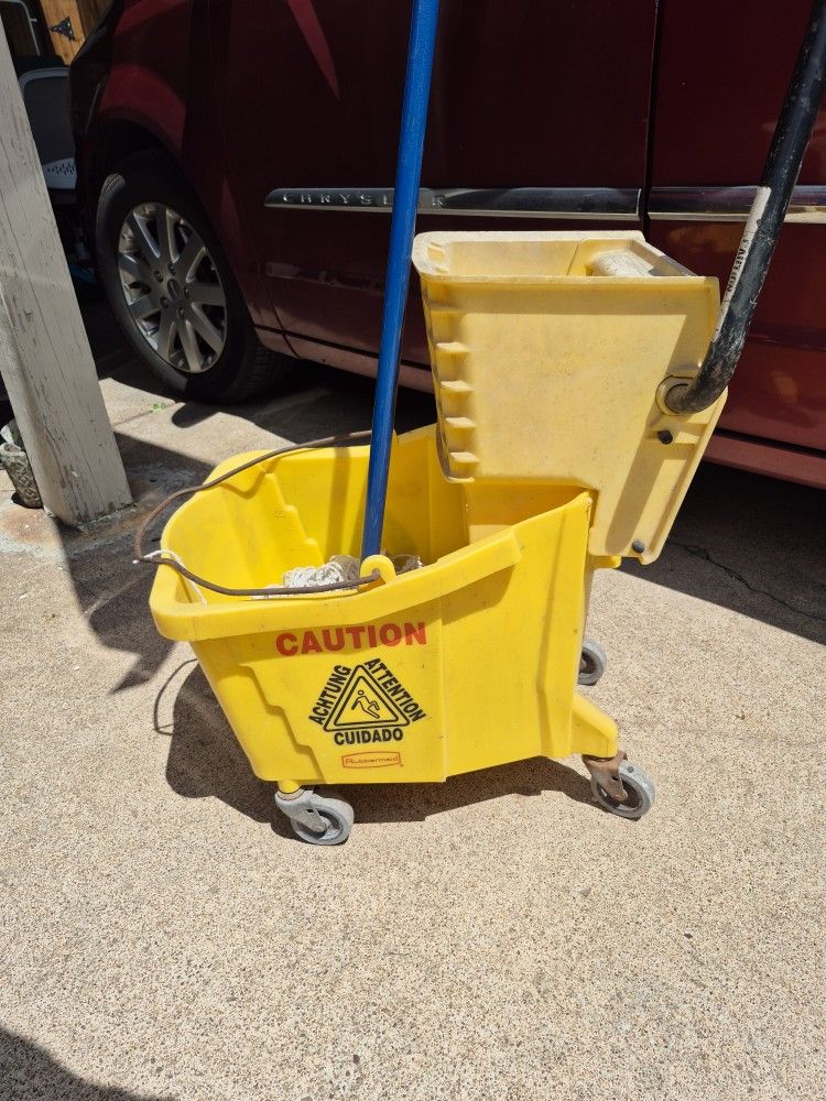 Nice Used Yellow Rubbermaid Mop Bucket. 