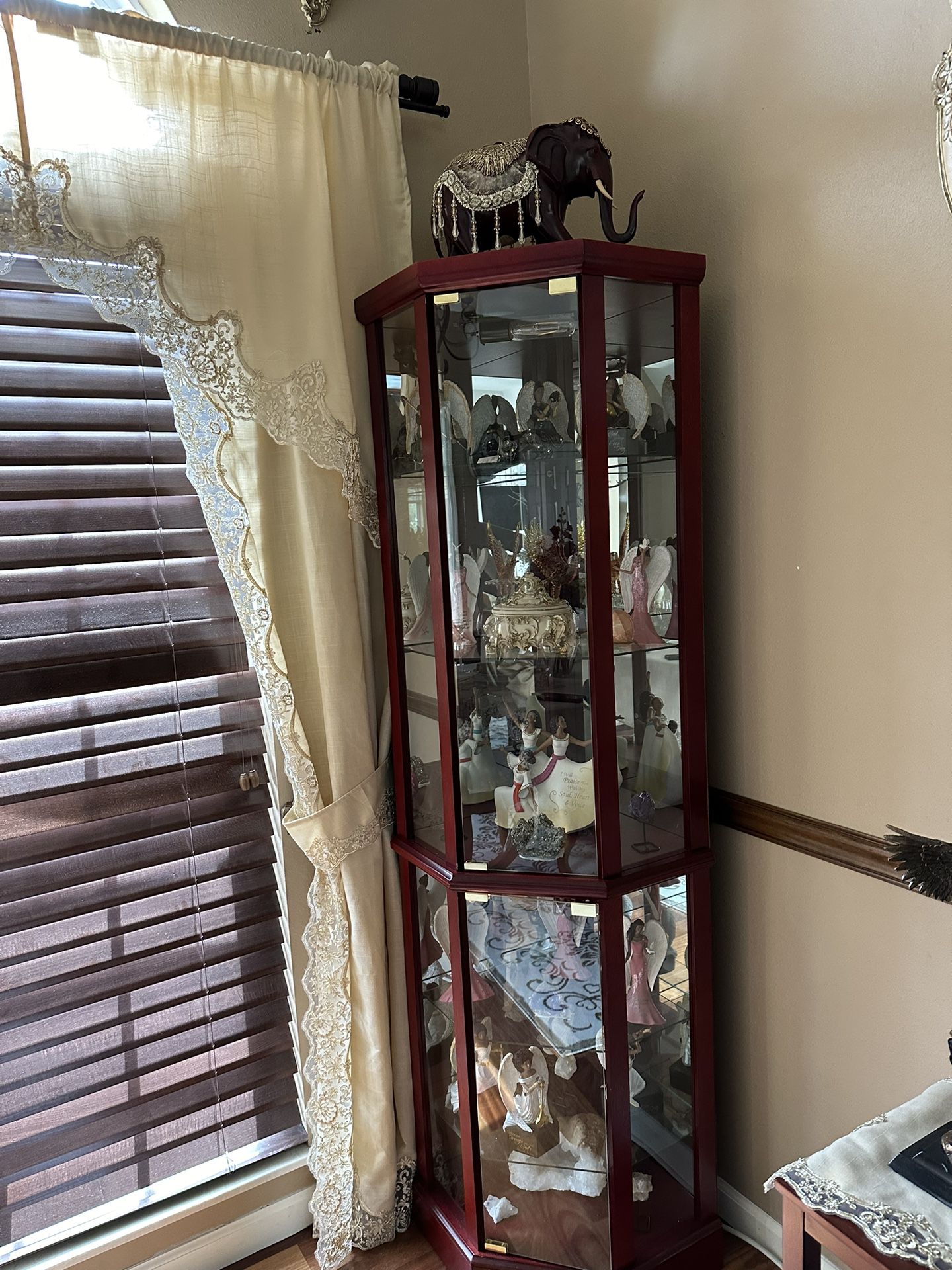 Curio Cabinet With Figurines