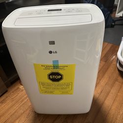 Portable air conditioner and window venting kit