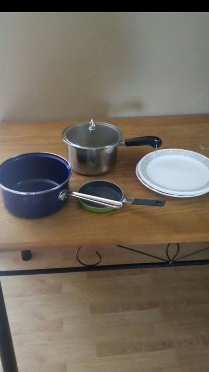 Kitchen pots, pan, and plates.