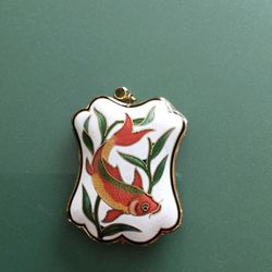 Cloisonné pendant with fish design.