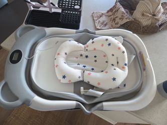 Baby bath tub and bottle rack
