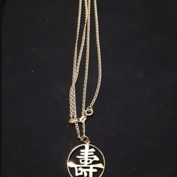 14KT GOLD 24" CHAIN AND 14KT GOLD ASIAN CHARM