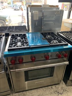 Wolf 36” slide in range with middle grill in stainless steel
