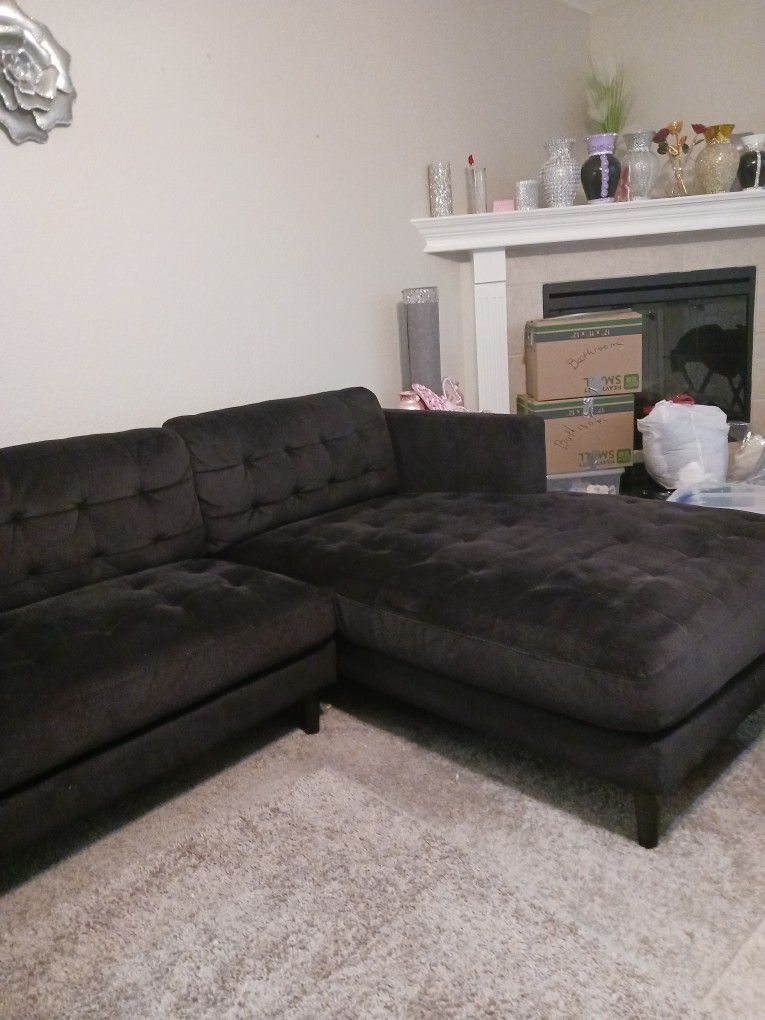 BLACK SECTIONAL ITS SCOTCHGUARED SO EASY TO GET SPOTS OFF..THERE ARE A FEW BUT CANT SEE
