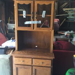 China hutch with glass, honey oak..drawers and good storage.