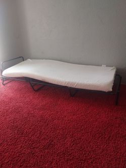 Folding metal guess with mattress size twin