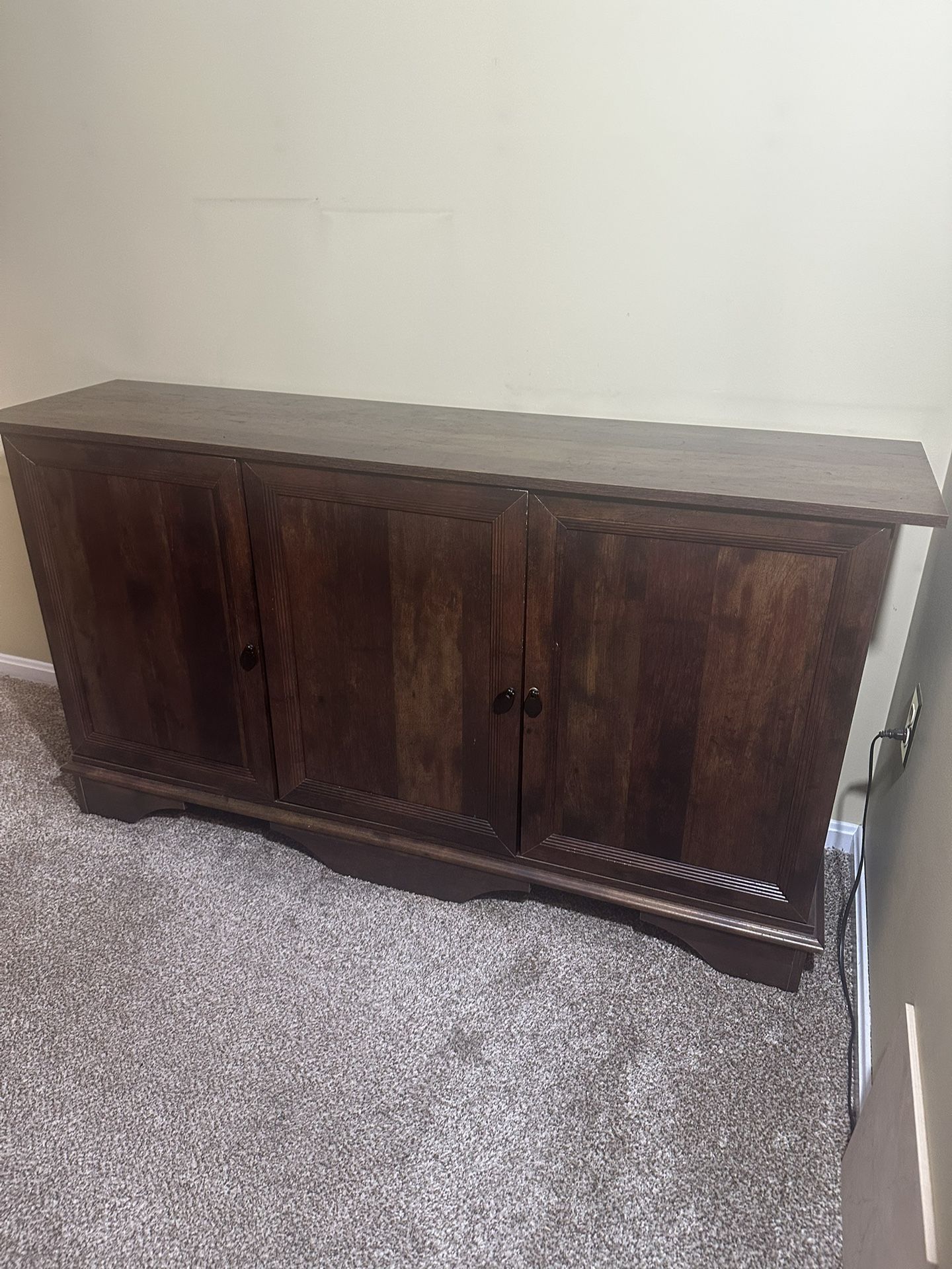 Wooden Cabinet With Three Doors And Two Shelves