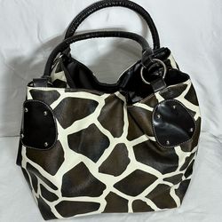 Super nice giraffe print handbag with red lining, very spacious.
