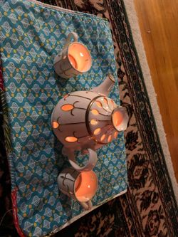 Antique tea kettle and 2 cups candle holders by party lite.