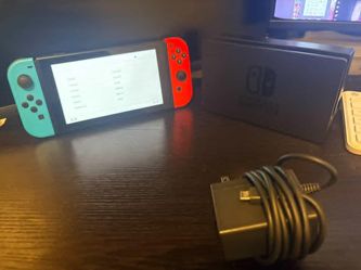 Slight used new nintendo switch with dock and charger and 64 gb