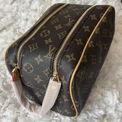 Louis Vuitton monogram cosmetic pouch. Clean interior, zip compartments, gently used.
