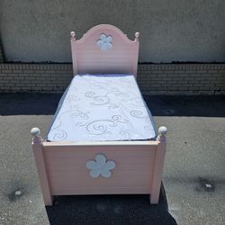 Pink twin size solid wood bed frame with brand-new twin size mattress and box spring in Plastics