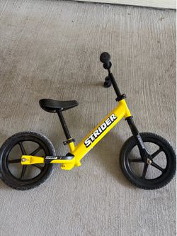 Strider 12” Sport Bike - No Pedal Balance Bicycle for Kids 1 to 4 Years - Includes Safety Pad, Padded Seat, Mini Grips & Flat-Free Tires - Tool-Free A