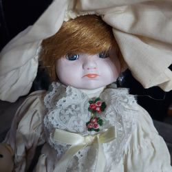 I am selling this heritage porcelain doll.She is 13 inches tall.She is a Musical doll